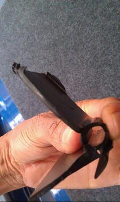 Lever for convertible top trunk storage compartment stopped working-holding-2-broken-pieces-together.jpg